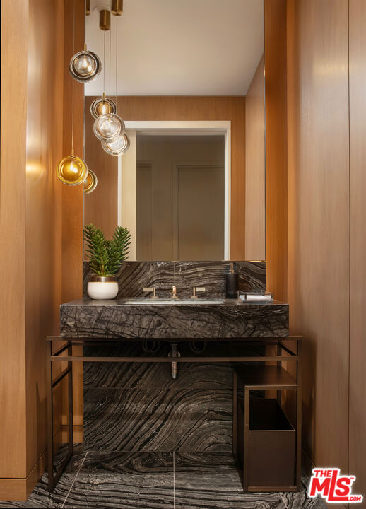211 Elm Court, Unit 26C Los Angeles, CA 90067 - Photo 11 of 14 a bathroom with a granite countertop sink and a mirror