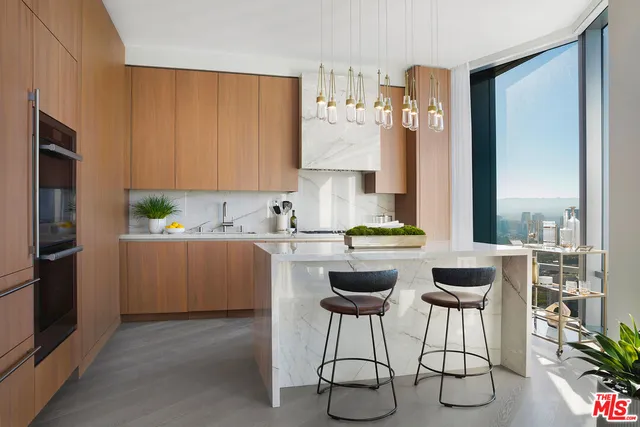 a kitchen with a refrigerator and cabinets