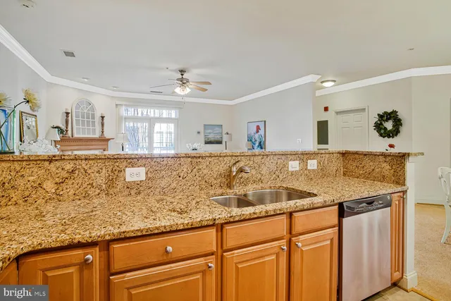 a kitchen with stainless steel appliances granite countertop a sink and a stove