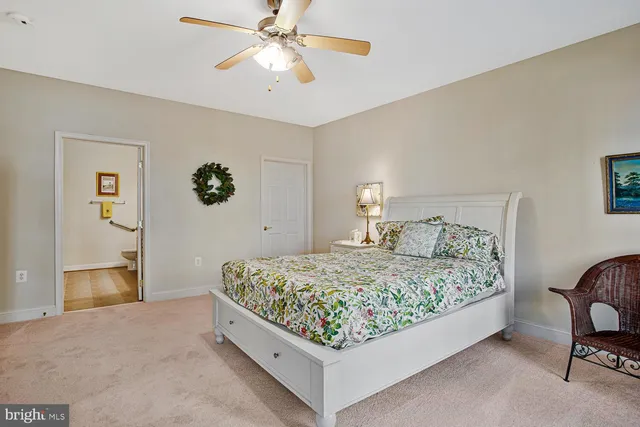 a bed room with a bed and a chandelier