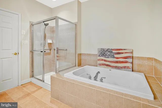 a bathroom with a granite countertop toilet sink and mirror