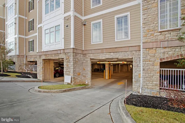 a view of a tall building next to a road