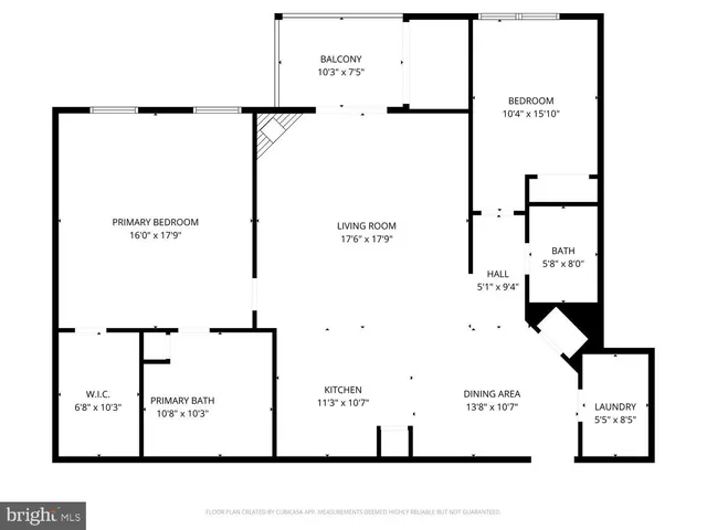 a view of a tennis ground with trees in the background