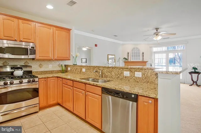 a dining room with wooden floor a chandelier