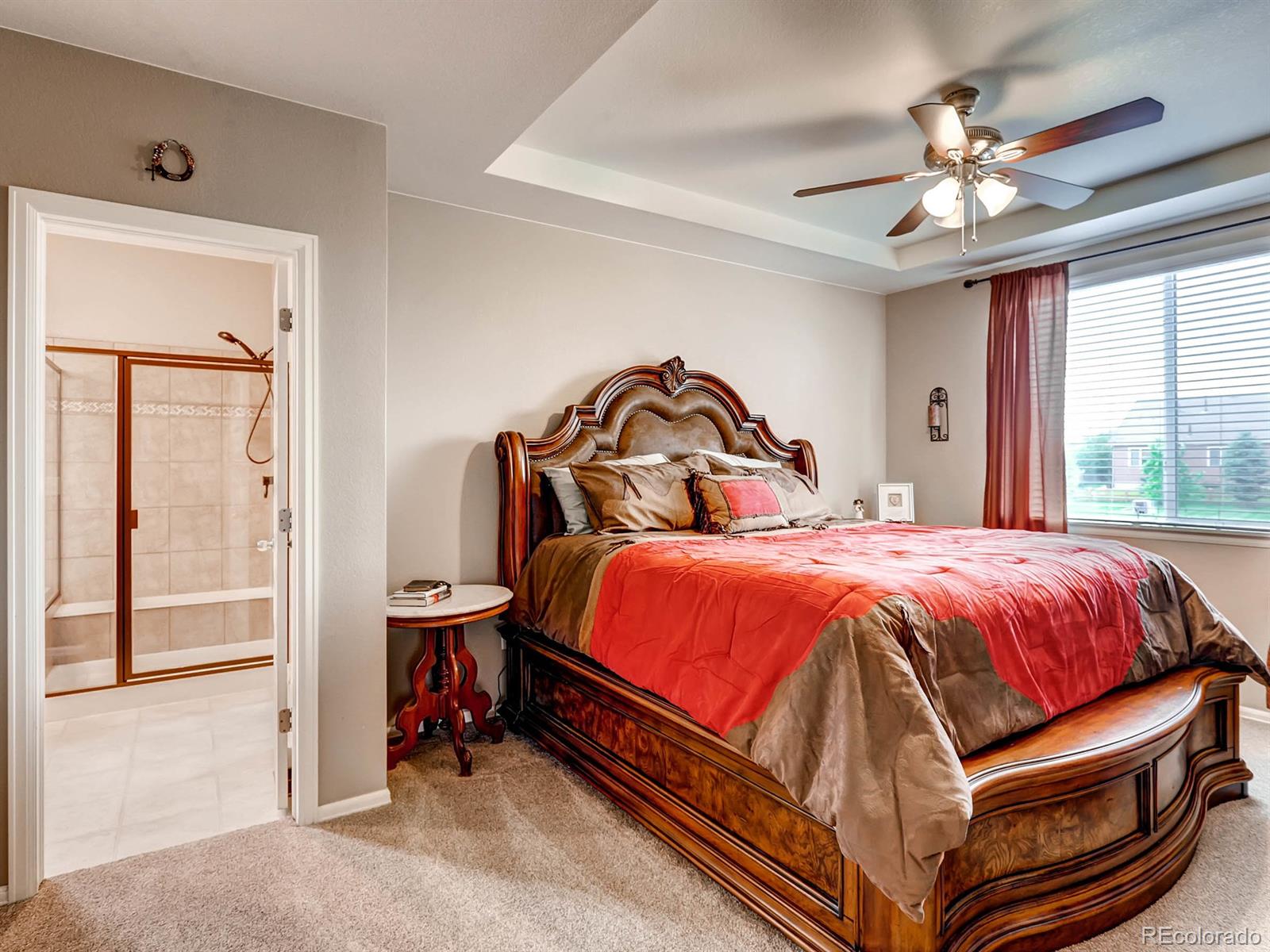 4500 Bramble Road Frederick, CO 80504 - Photo 11 of 25 a bedroom with a bed and window