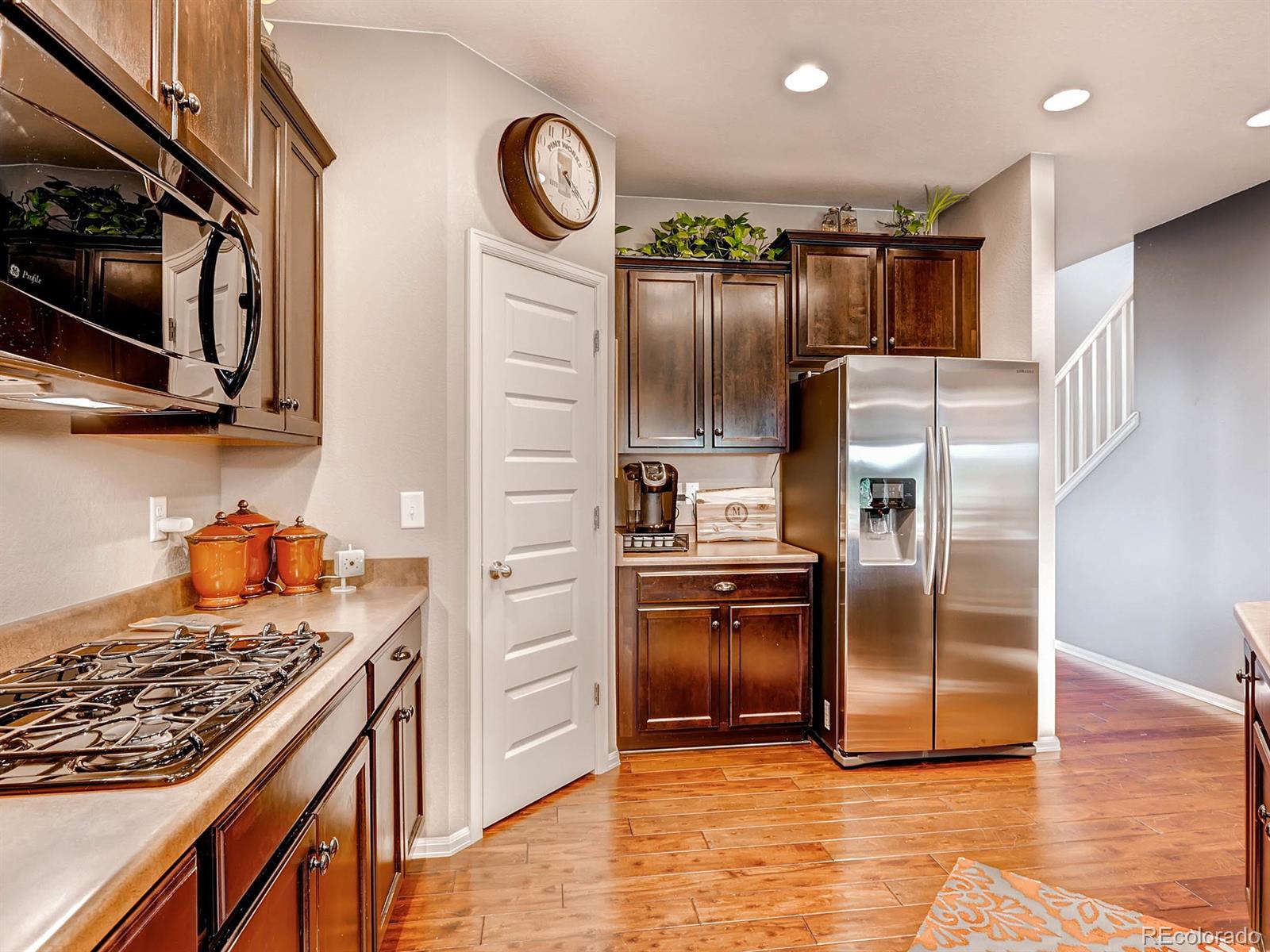4500 Bramble Road Frederick, CO 80504 - Photo 7 of 25 a kitchen with stainless steel appliances granite countertop a refrigerator a stove and a sink