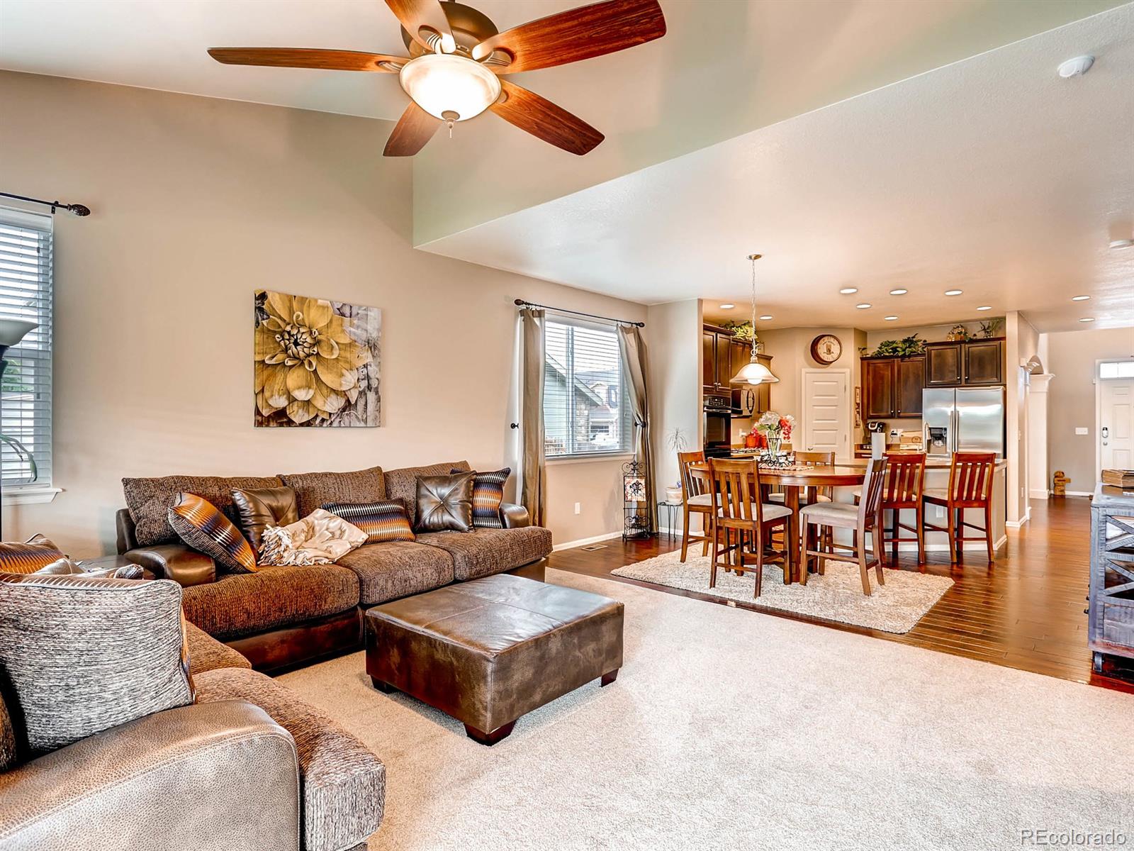 4500 Bramble Road Frederick, CO 80504 - Photo 9 of 25 a living room with furniture kitchen view and a large window