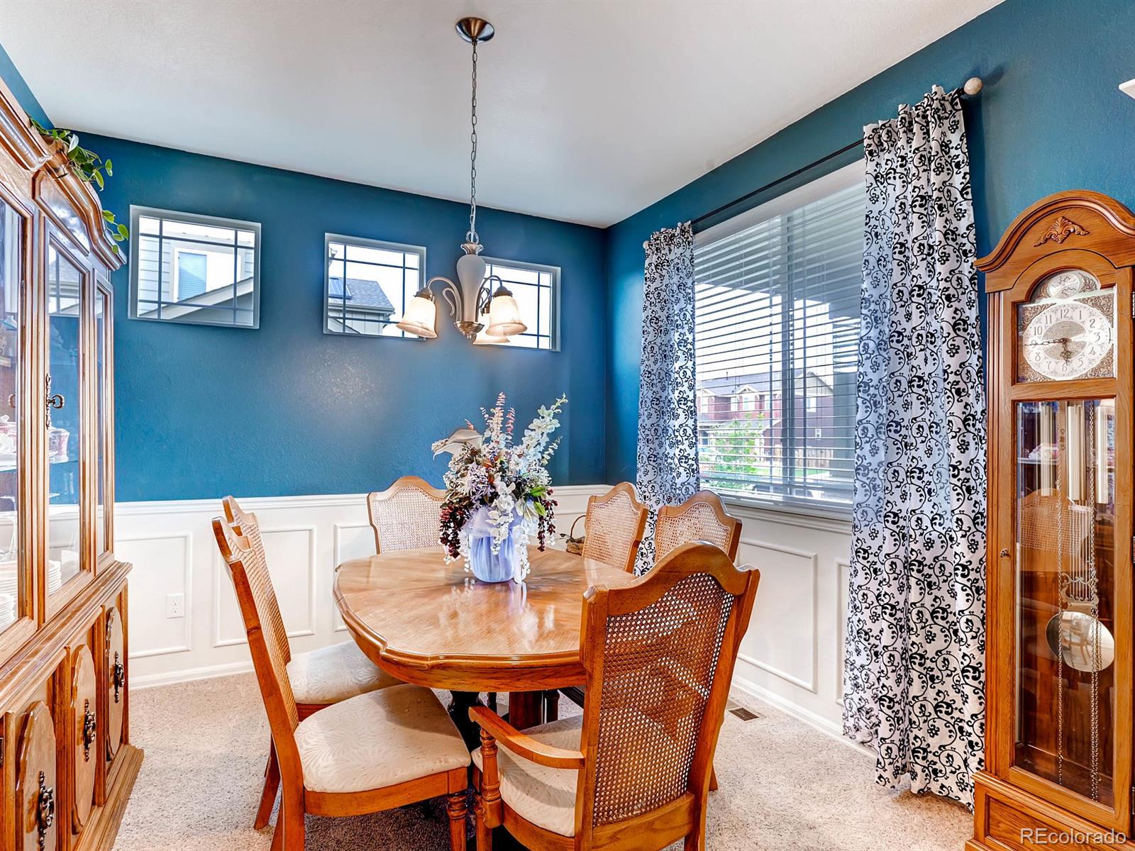 4500 Bramble Road Frederick, CO 80504 - Photo 10 of 25 a dining room with furniture a chandelier and window