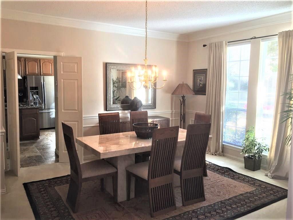 4309 Mead Drive Plano, TX 75024 - Photo 12 of 25 a view of a dining room with furniture window and wooden floor