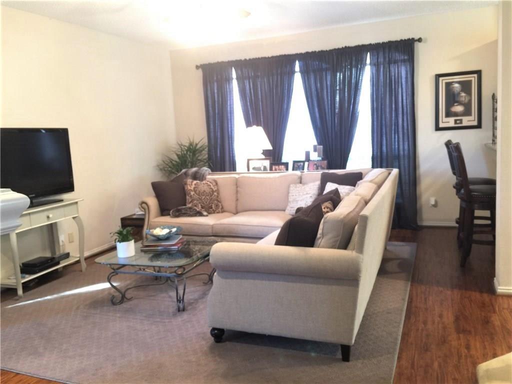 4309 Mead Drive Plano, TX 75024 - Photo 13 of 25 a living room with furniture a flat screen tv and a window
