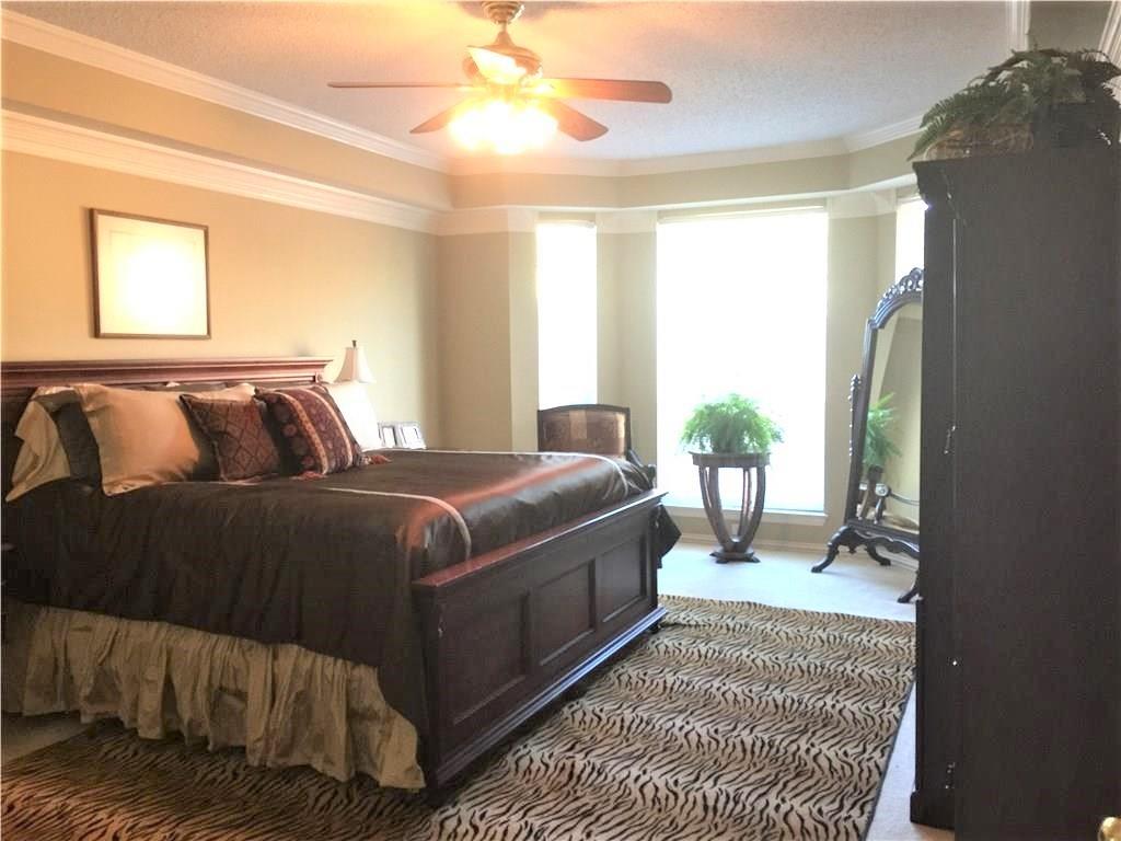 4309 Mead Drive Plano, TX 75024 - Photo 16 of 25 a bedroom with a bed lamp and a large window