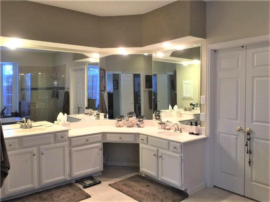 4309 Mead Drive Plano, TX 75024 - Photo 17 of 25 a bathroom with a double vanity sink mirror and double