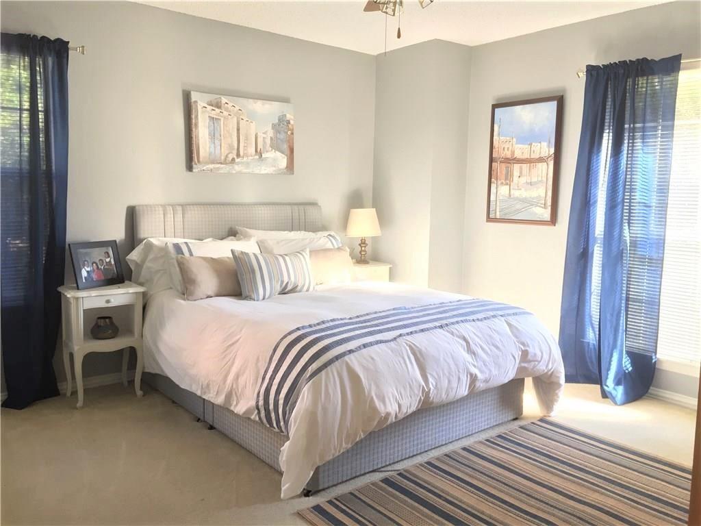 4309 Mead Drive Plano, TX 75024 - Photo 18 of 25 a bedroom with a bed and wooden floor