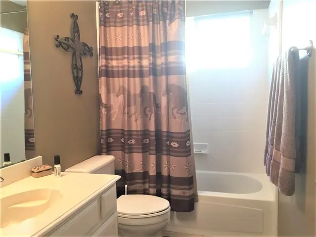 a bedroom with bed and window