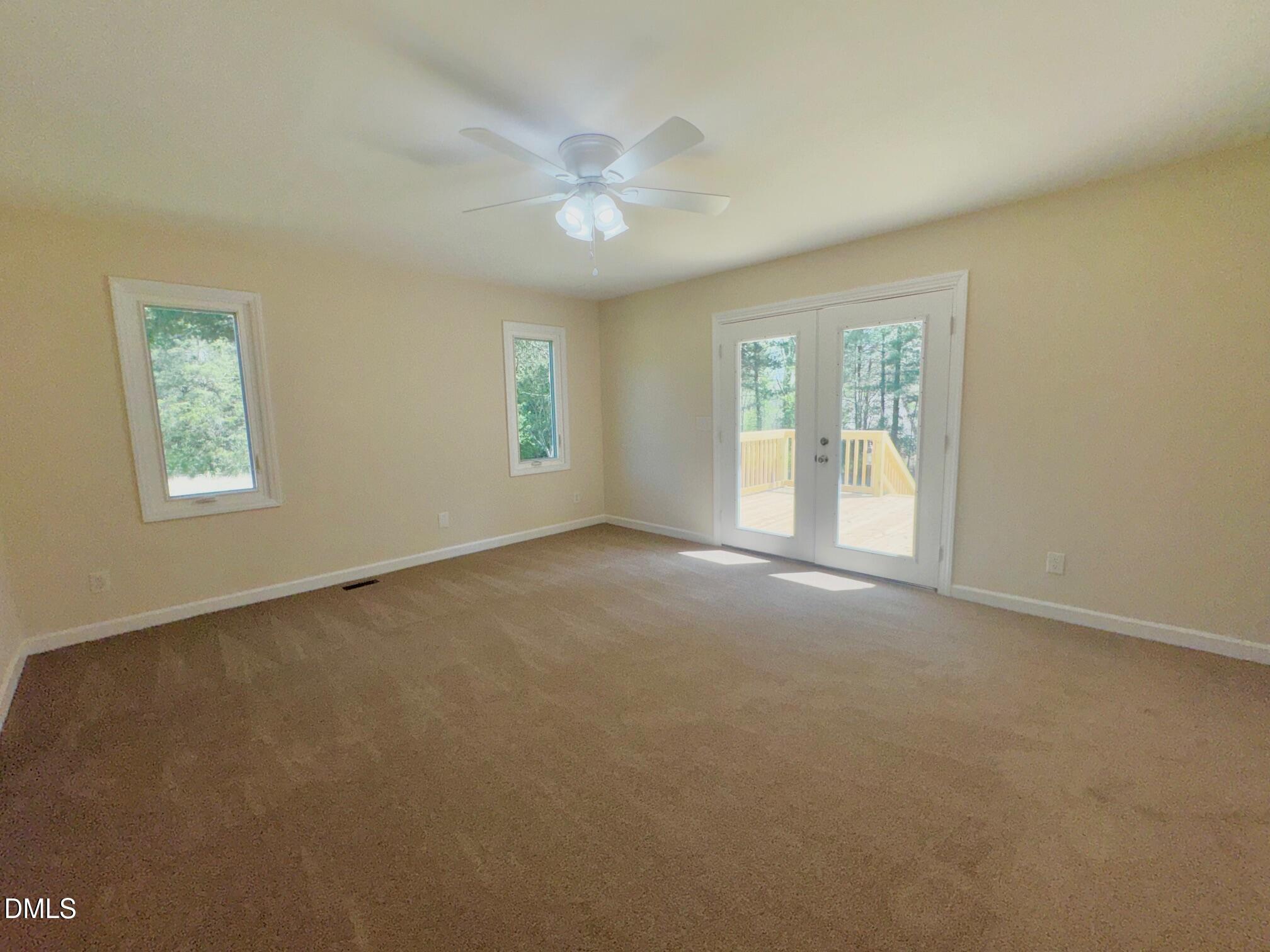 1720 Ross Mill Road Henderson, NC 27537 - Photo 21 of 42 a view of an empty room with a window