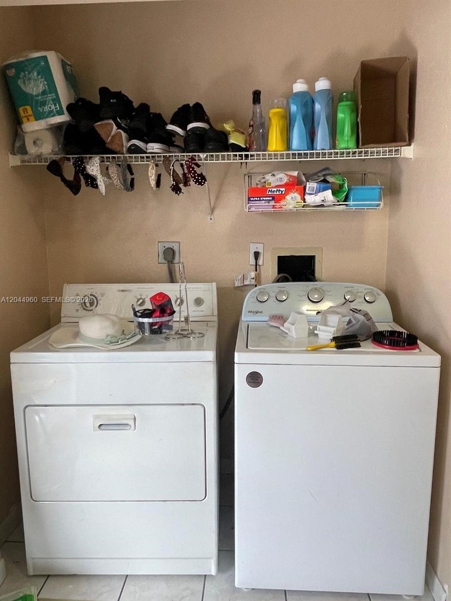 7681 Northwest 178th Terrace Hialeah, FL 33015 - Photo 9 of 11 a utility room with dryer and washer