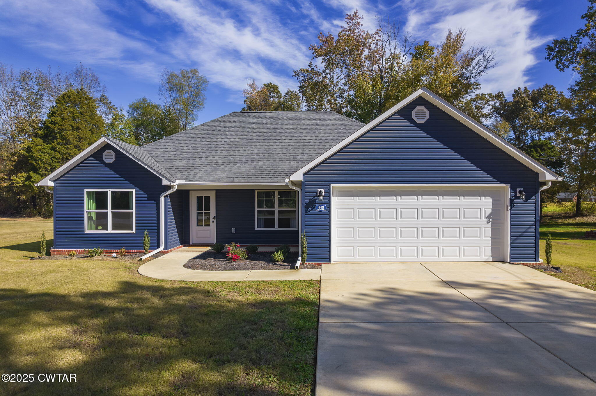448 Old Jackson Road Henderson, TN 38340 - Photo 1 of 32 a front view of a house with yard and tress