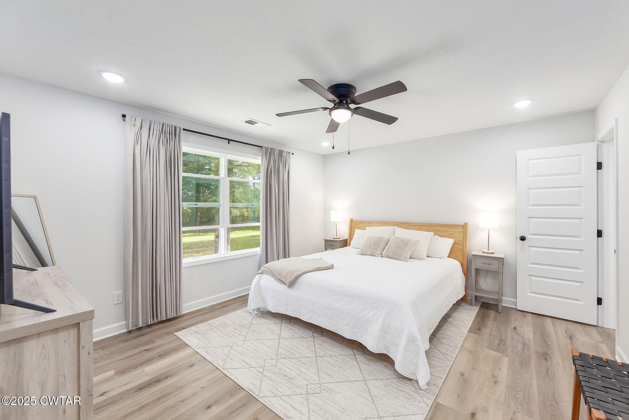 448 Old Jackson Road Henderson, TN 38340 - Photo 11 of 32 a bedroom with a large bed and a window