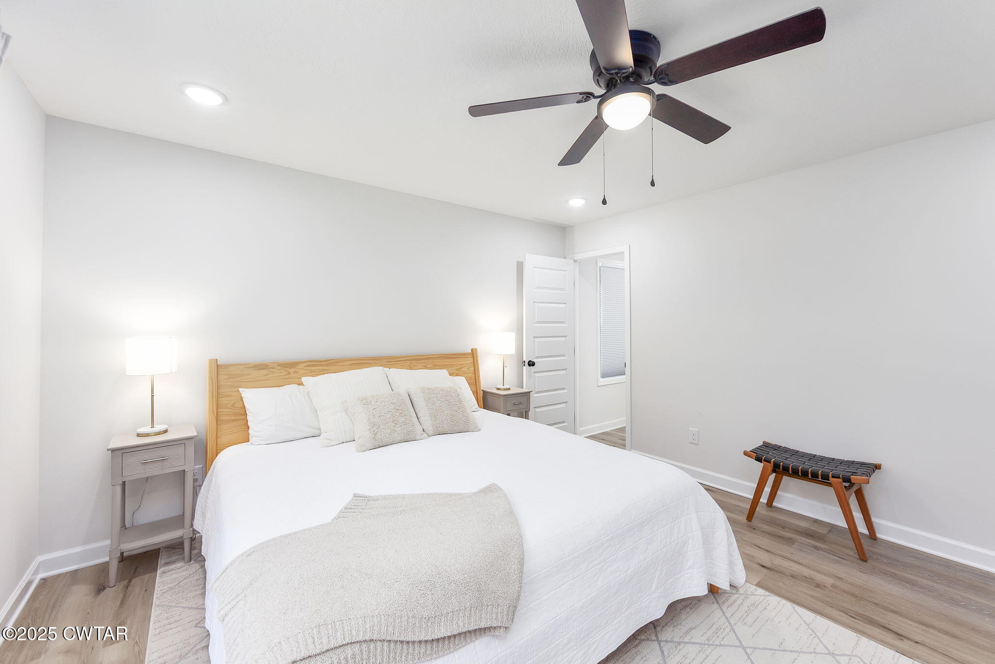 448 Old Jackson Road Henderson, TN 38340 - Photo 12 of 32 a bedroom with a bed and a ceiling fan