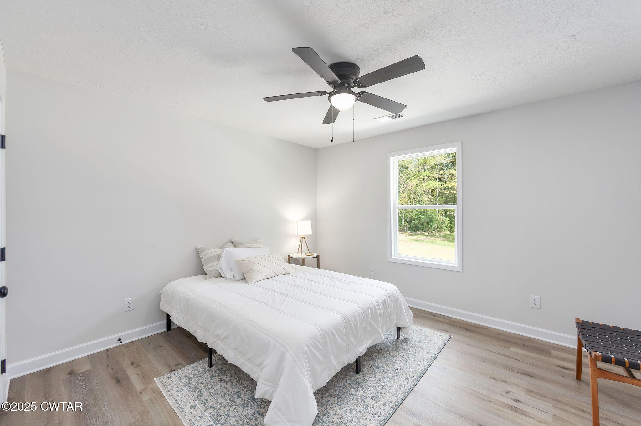 448 Old Jackson Road Henderson, TN 38340 - Photo 17 of 32 a bedroom with a bed and a window