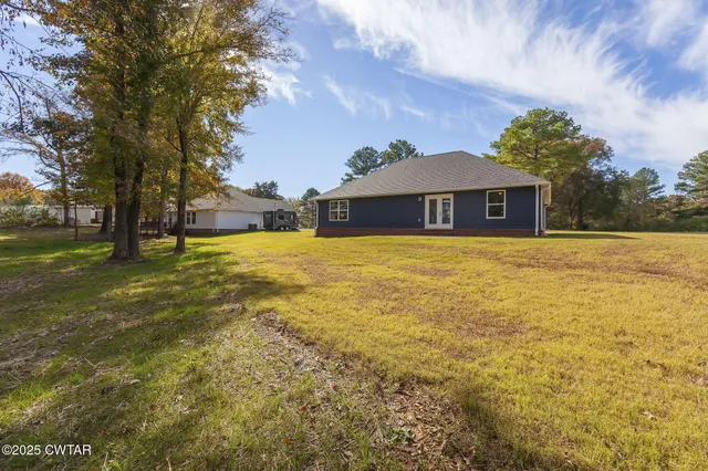 a view of swimming pool with a yard