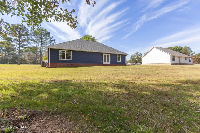 a view of big yard with an outdoor space