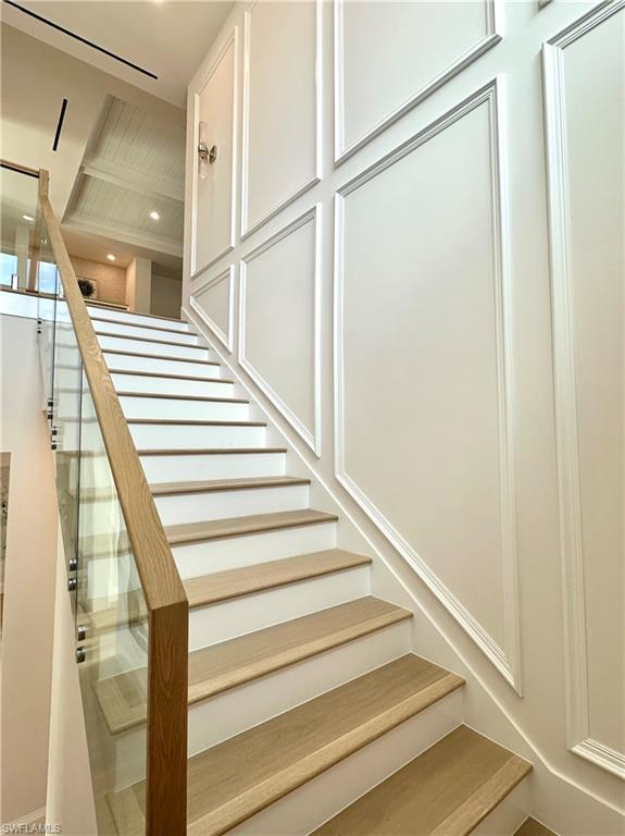 809 Wedge Drive Naples, FL 34103 - Photo 10 of 32 Staircase with a decorative wall