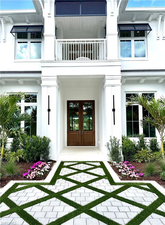 809 Wedge Drive Naples, FL 34103 - Photo 26 of 32 Entrance to property witstucco siding