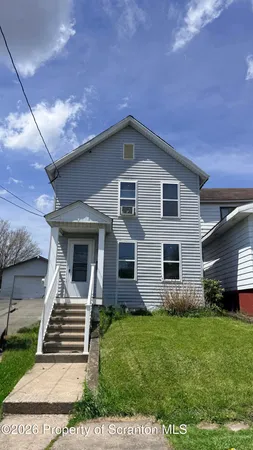 a front view of house with yard