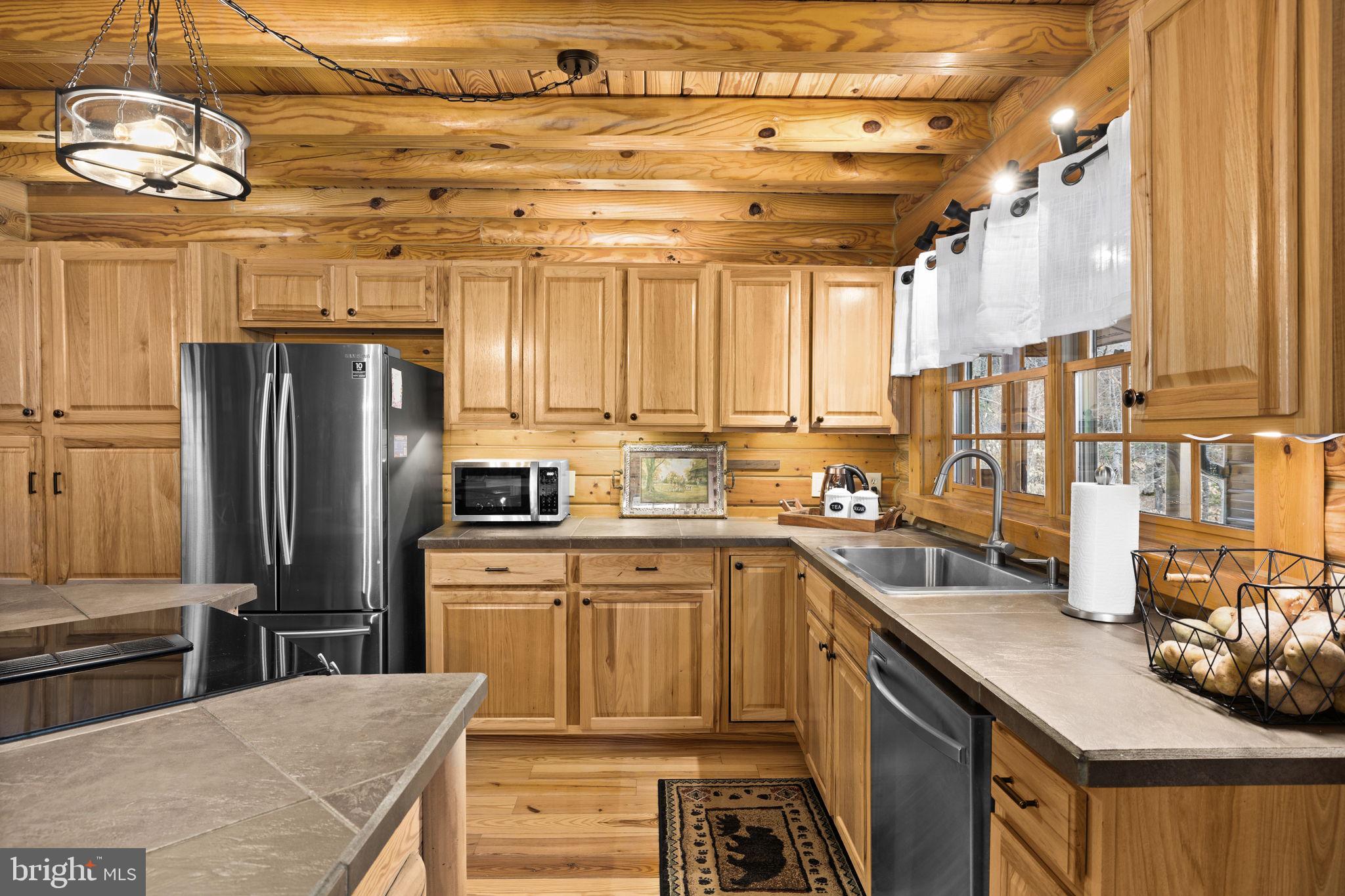 17 Fox Run Bumpass, VA 23024 - Photo 14 of 47 a kitchen with stainless steel appliances granite countertop a sink a stove and a refrigerator