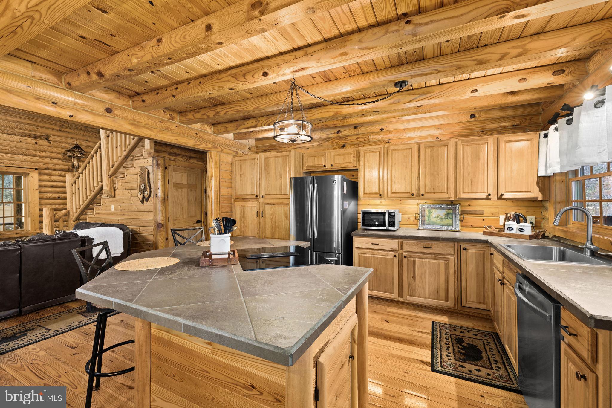 17 Fox Run Bumpass, VA 23024 - Photo 15 of 47 a kitchen with stainless steel appliances granite countertop a sink a stove and refrigerator