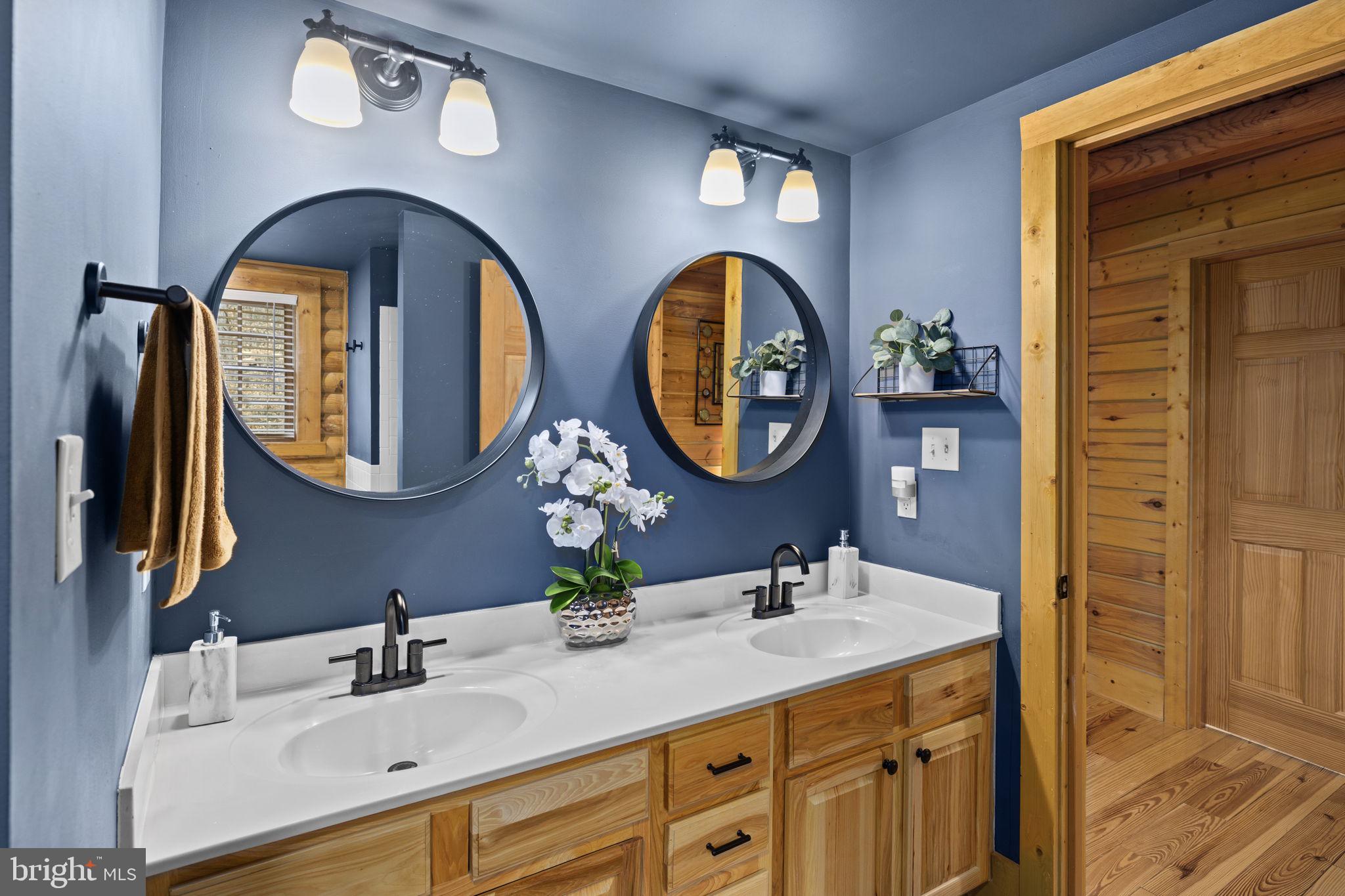 17 Fox Run Bumpass, VA 23024 - Photo 21 of 47 a bathroom with a granite countertop double vanity sinks and a large mirror