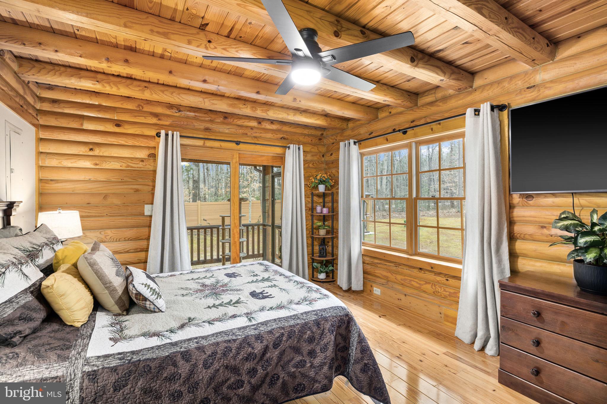 17 Fox Run Bumpass, VA 23024 - Photo 23 of 47 a bedroom with a bed and large windows