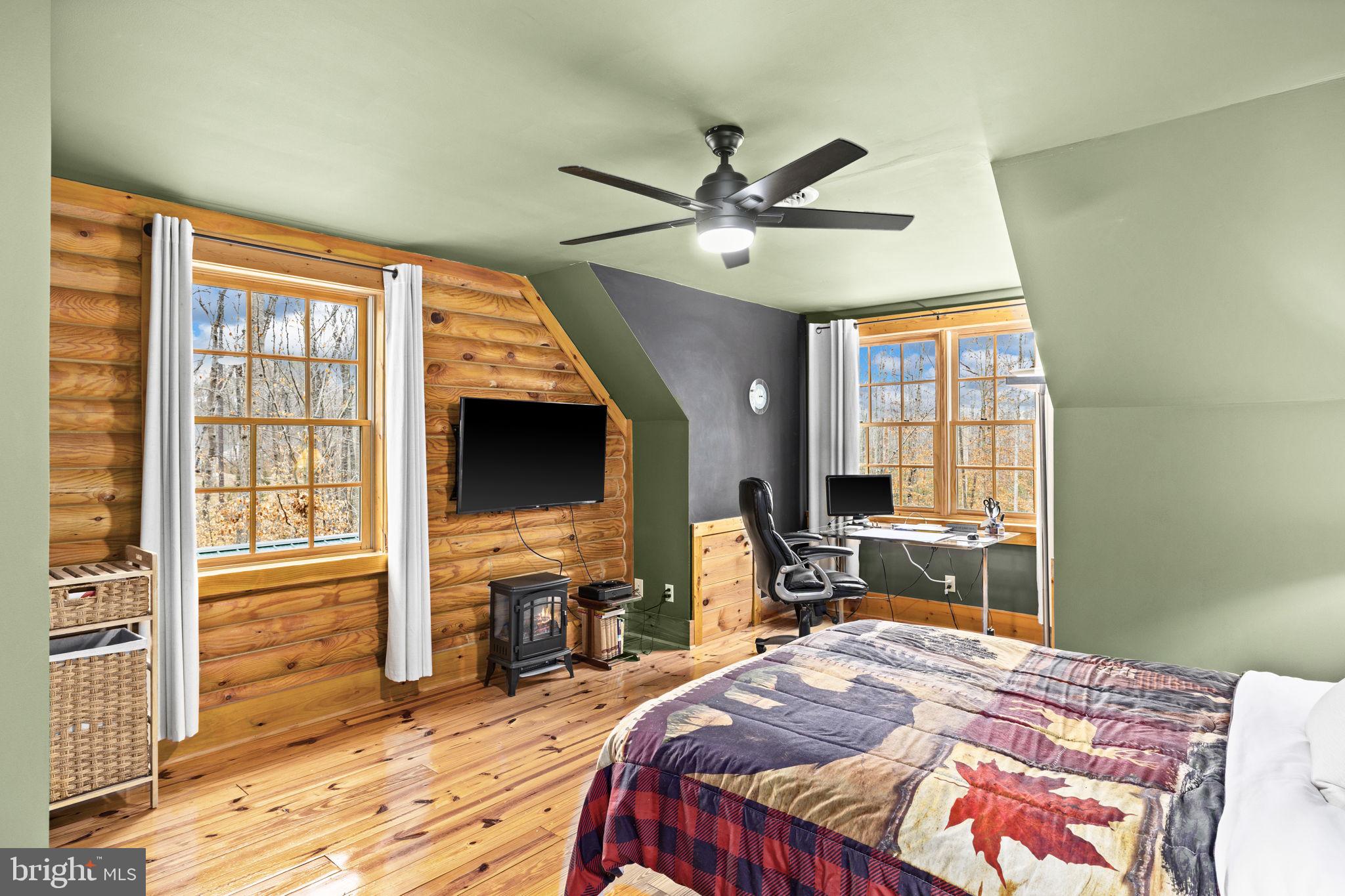 17 Fox Run Bumpass, VA 23024 - Photo 27 of 47 a bedroom with a bed and wooden floor