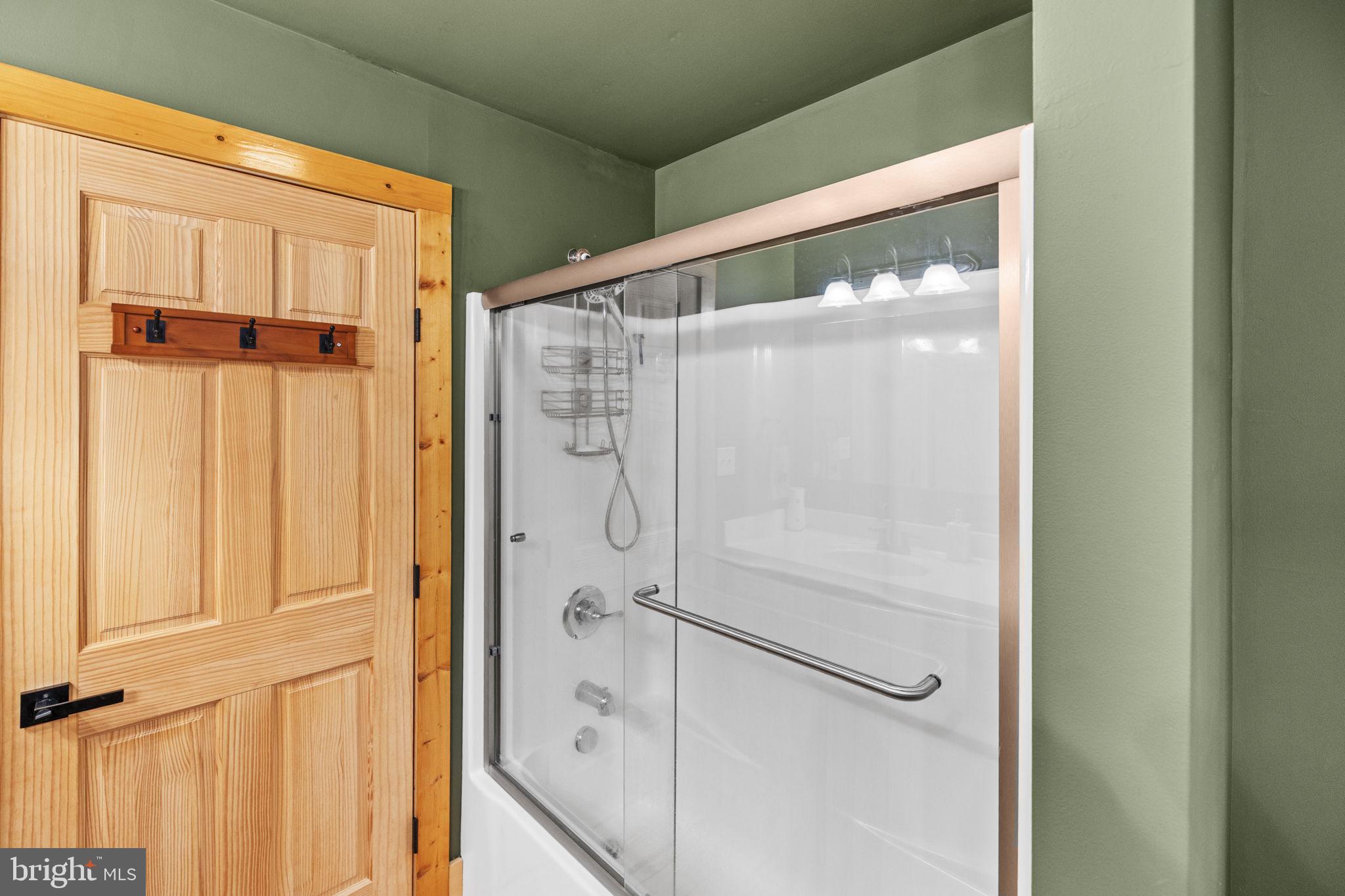 17 Fox Run Bumpass, VA 23024 - Photo 32 of 47 a bathroom with a glass shower door