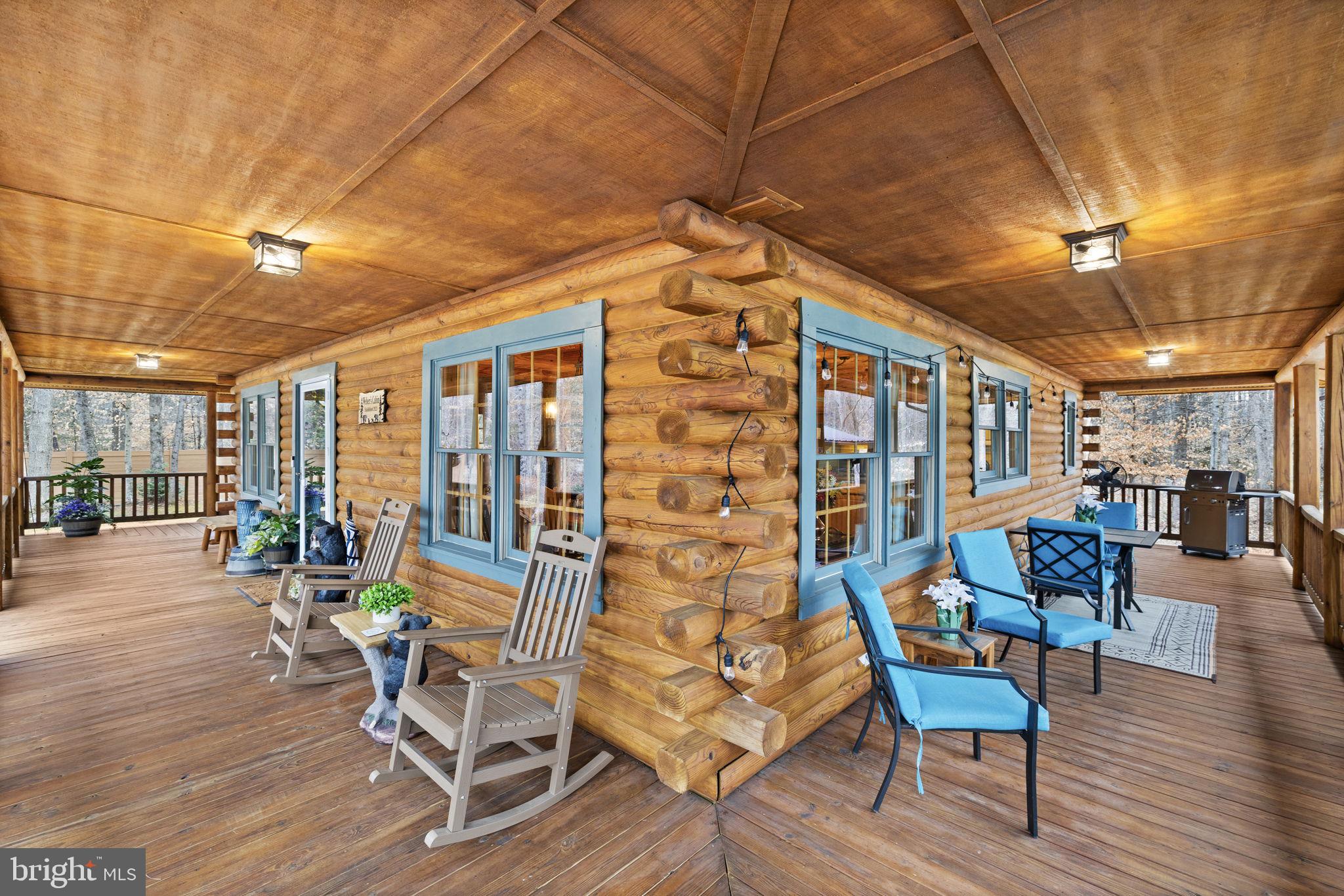 17 Fox Run Bumpass, VA 23024 - Photo 36 of 47 a outdoor space with lots of chairs and wooden floor