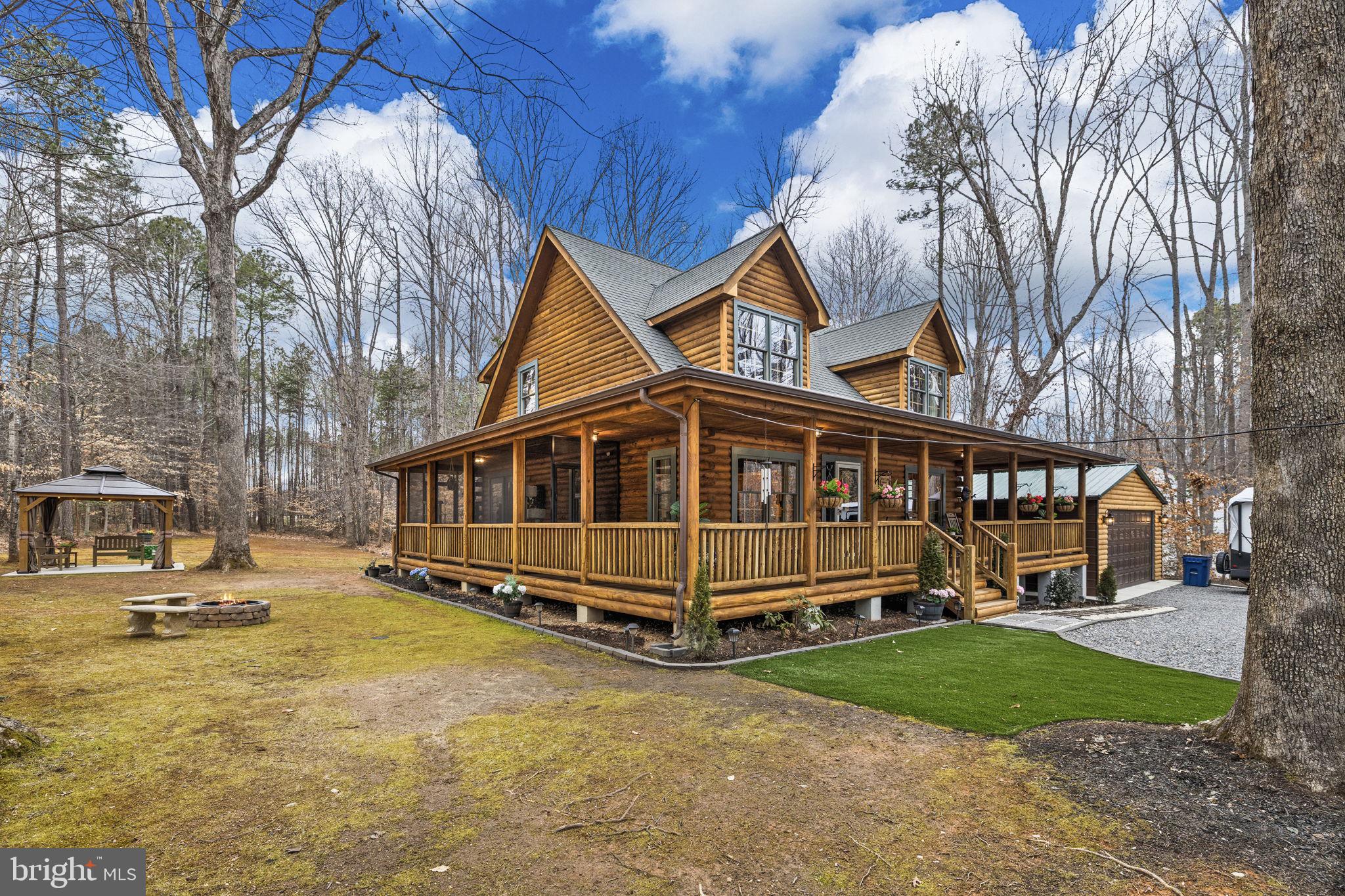 17 Fox Run Bumpass, VA 23024 - Photo 39 of 47 a view of a house with a yard patio and fire pit