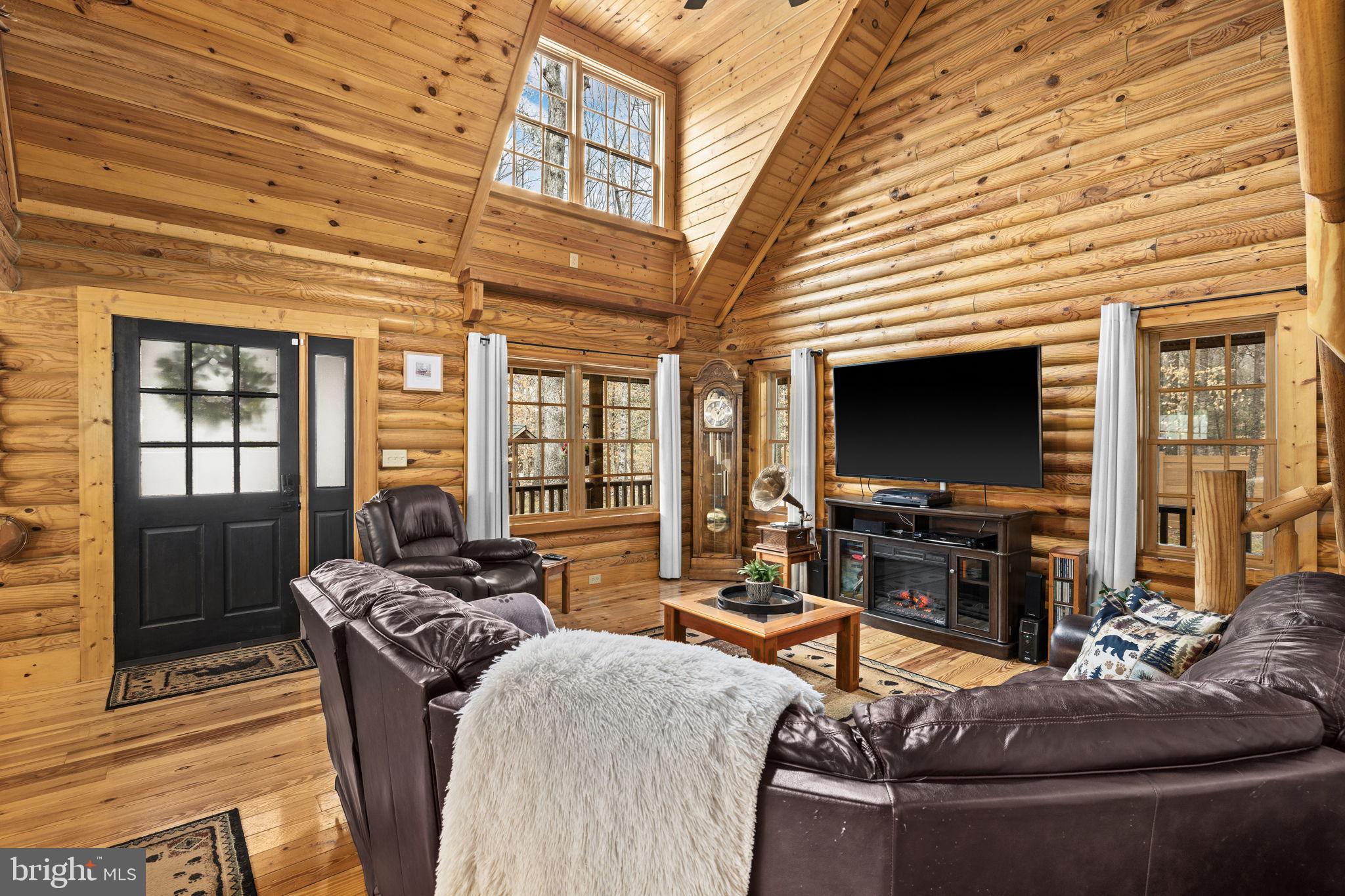 17 Fox Run Bumpass, VA 23024 - Photo 8 of 47 a living room with fireplace furniture and a flat screen tv