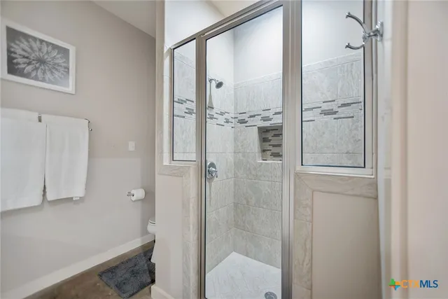 a bed room with a bed and a window