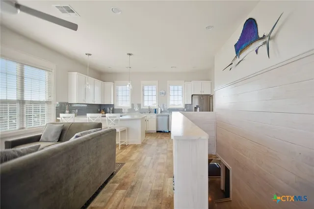 a stove top oven sitting inside of a kitchen