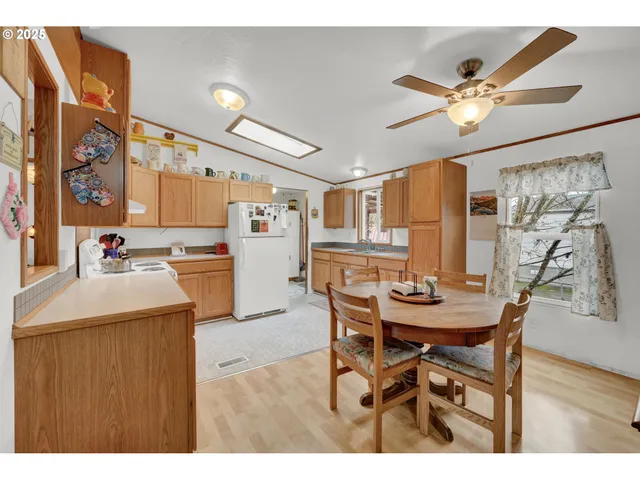 a kitchen with a table and chairs