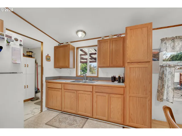 a kitchen with stainless steel appliances a refrigerator and a sink