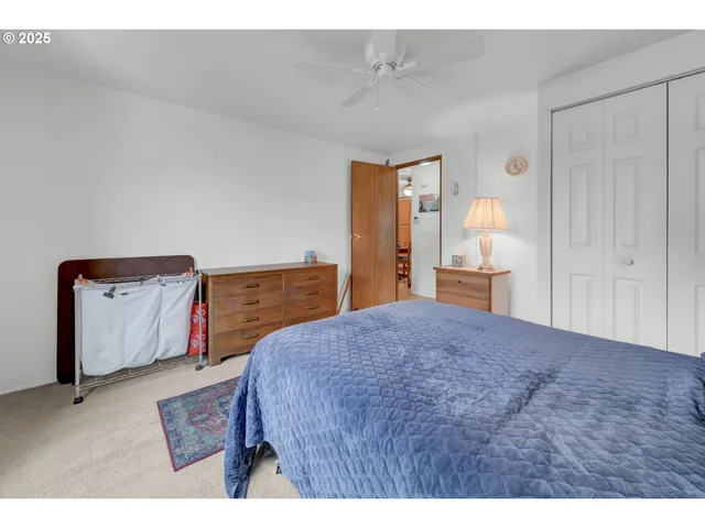 a bedroom with a bed and a cabinets