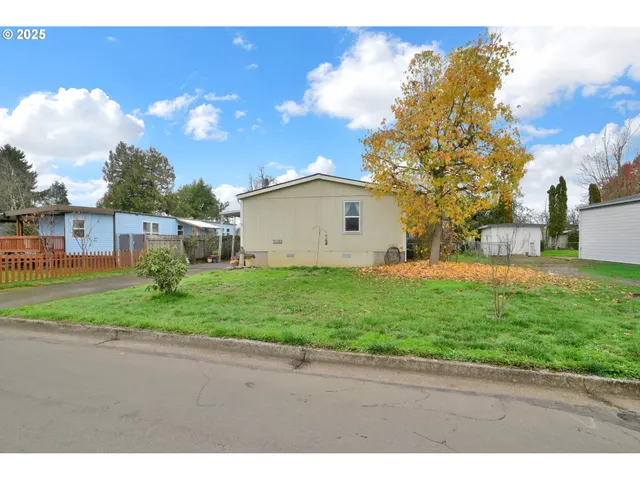 a view of a backyard of the house