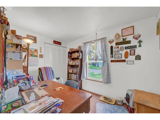 a bedroom with furniture and a book shelf