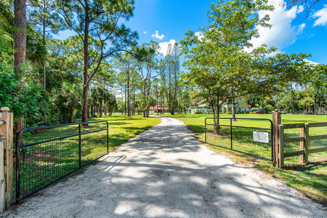 1835 Stallion Drive, Unit STALLS Loxahatchee, FL 33470 - Photo 13 of 35 a view of a park with large trees