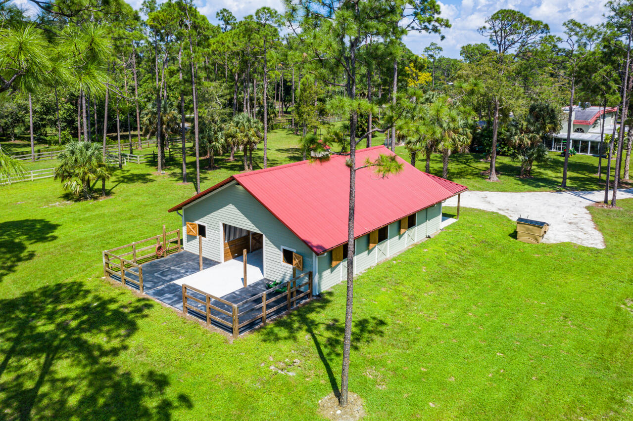 1835 Stallion Drive, Unit STALLS Loxahatchee, FL 33470 - Photo 14 of 35 a aerial view of a house with a big yard