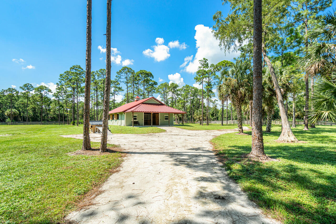 1835 Stallion Drive, Unit STALLS Loxahatchee, FL 33470 - Photo 17 of 35 a view of yard with tree s