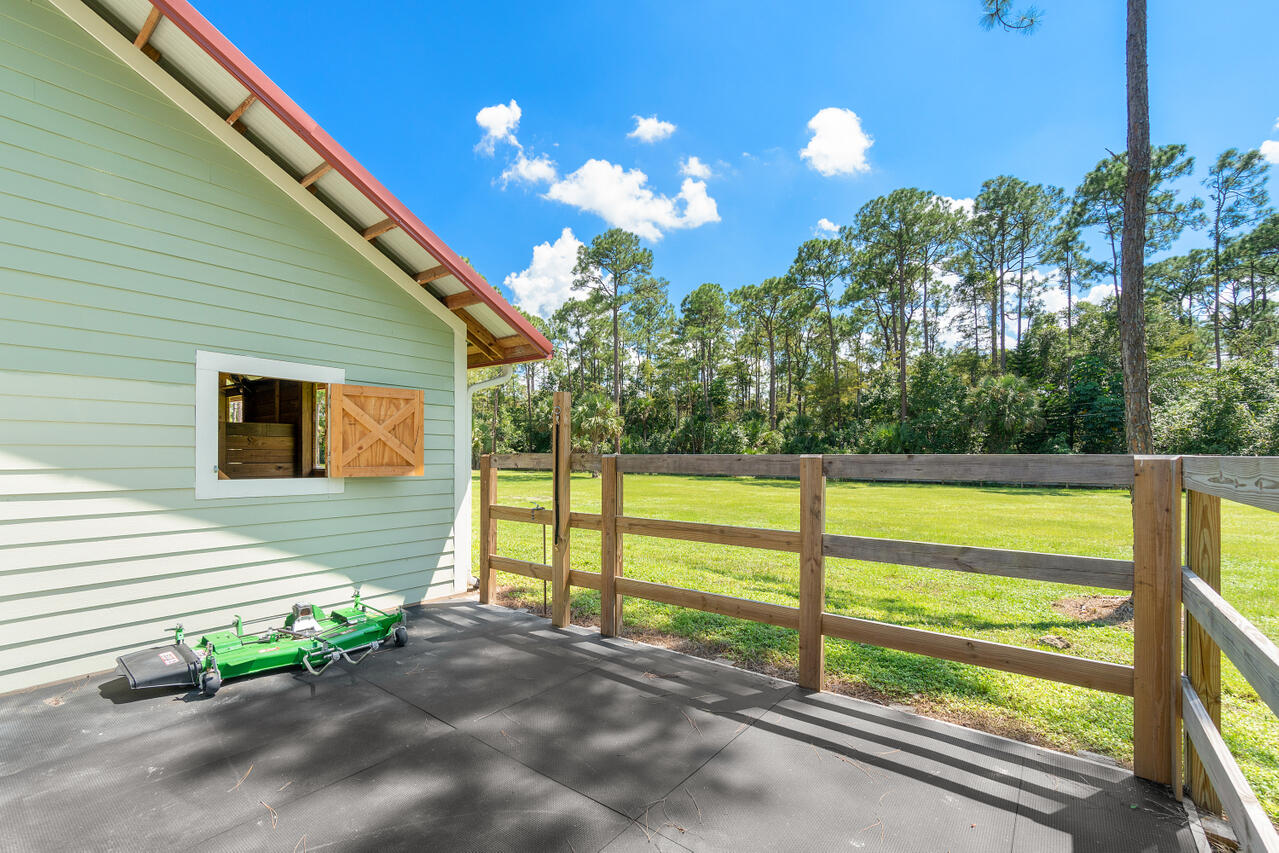 1835 Stallion Drive, Unit STALLS Loxahatchee, FL 33470 - Photo 20 of 35 a view of a house with a yard