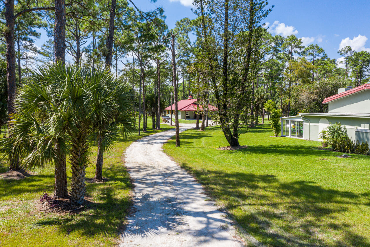 1835 Stallion Drive, Unit STALLS Loxahatchee, FL 33470 - Photo 26 of 35 a view of a park with large trees